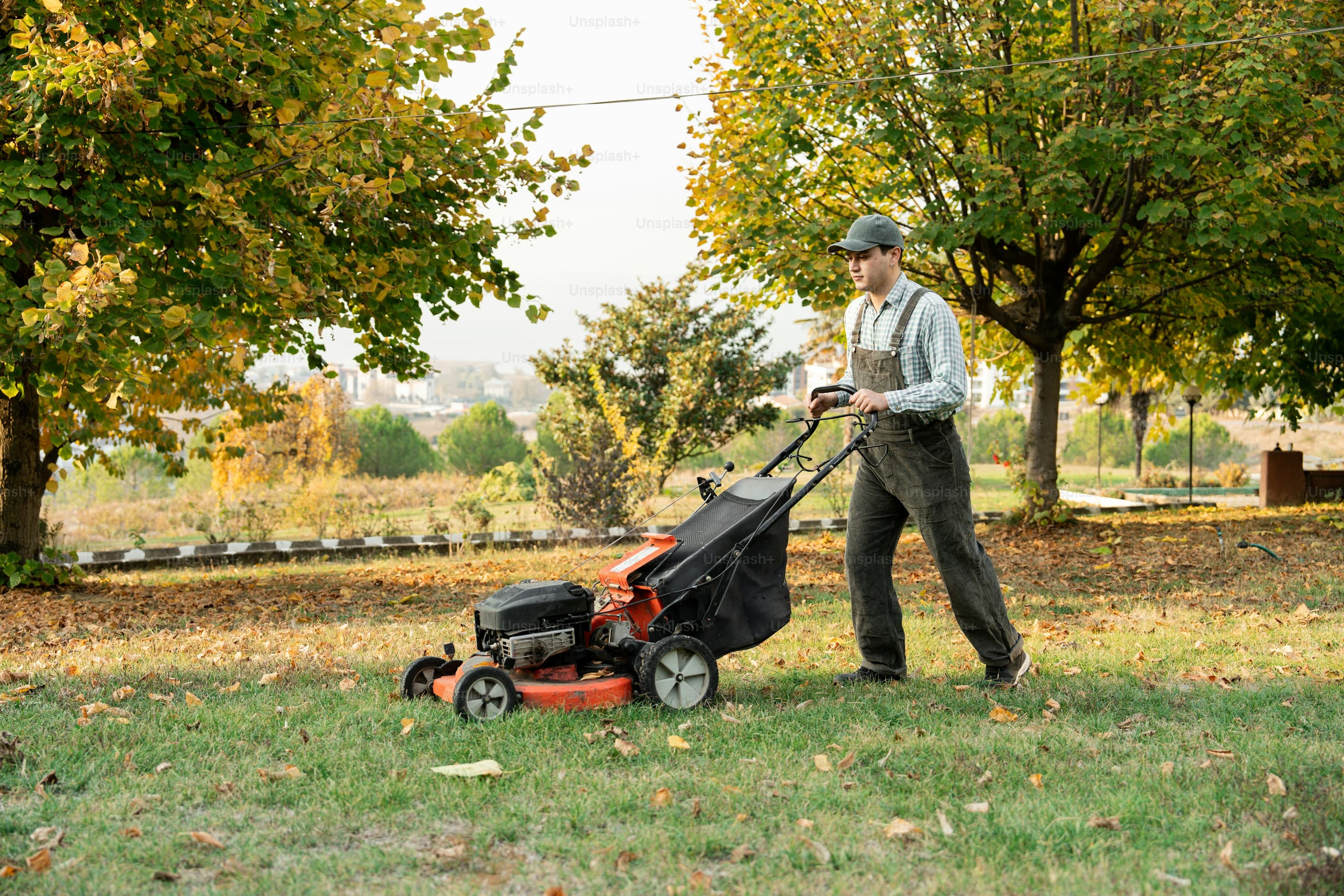 Professional mowing a lawn